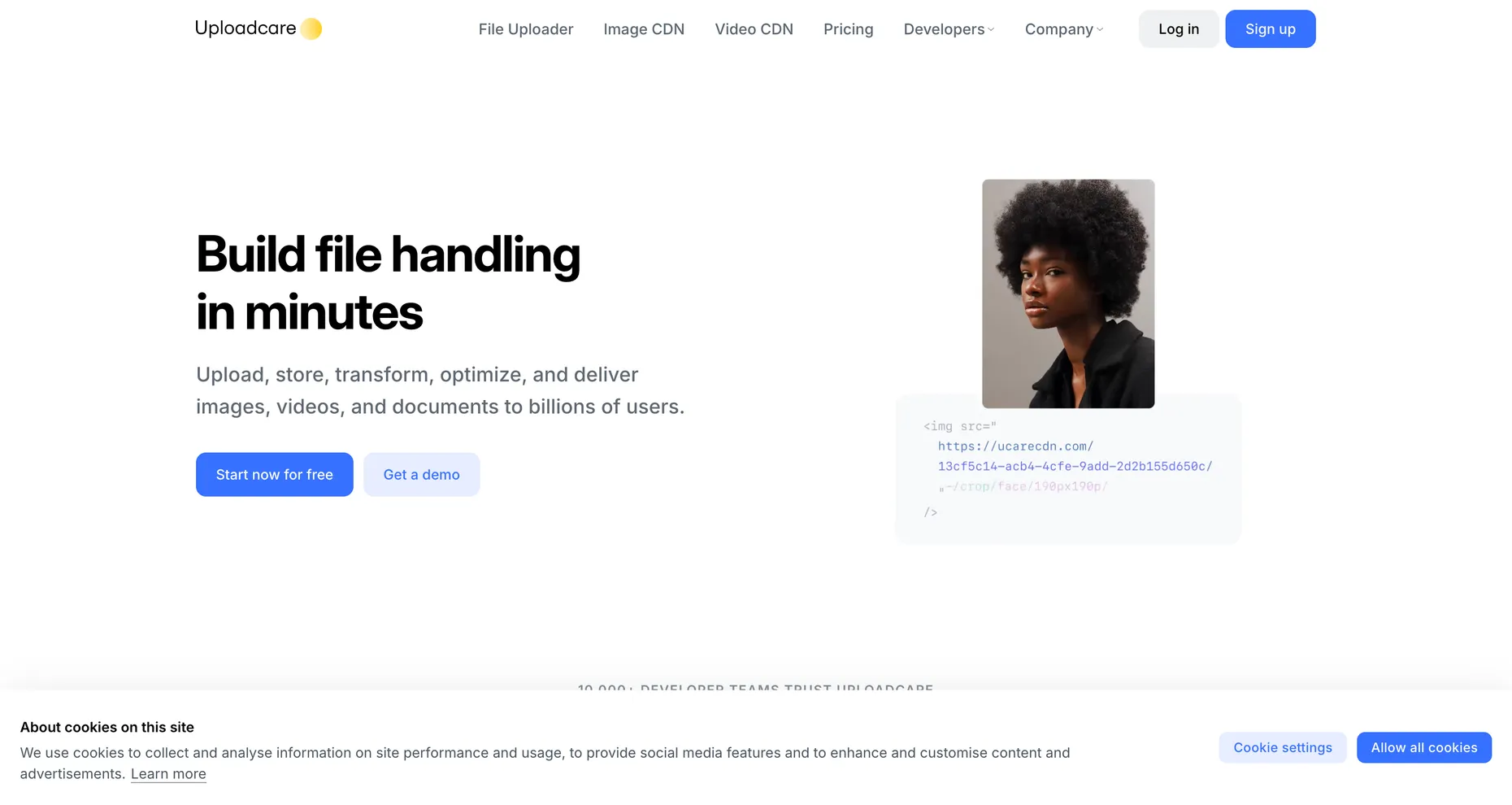 The Uploadcare homepage, headline Build file handling in minutes, showing a URL-based face-crop transform.