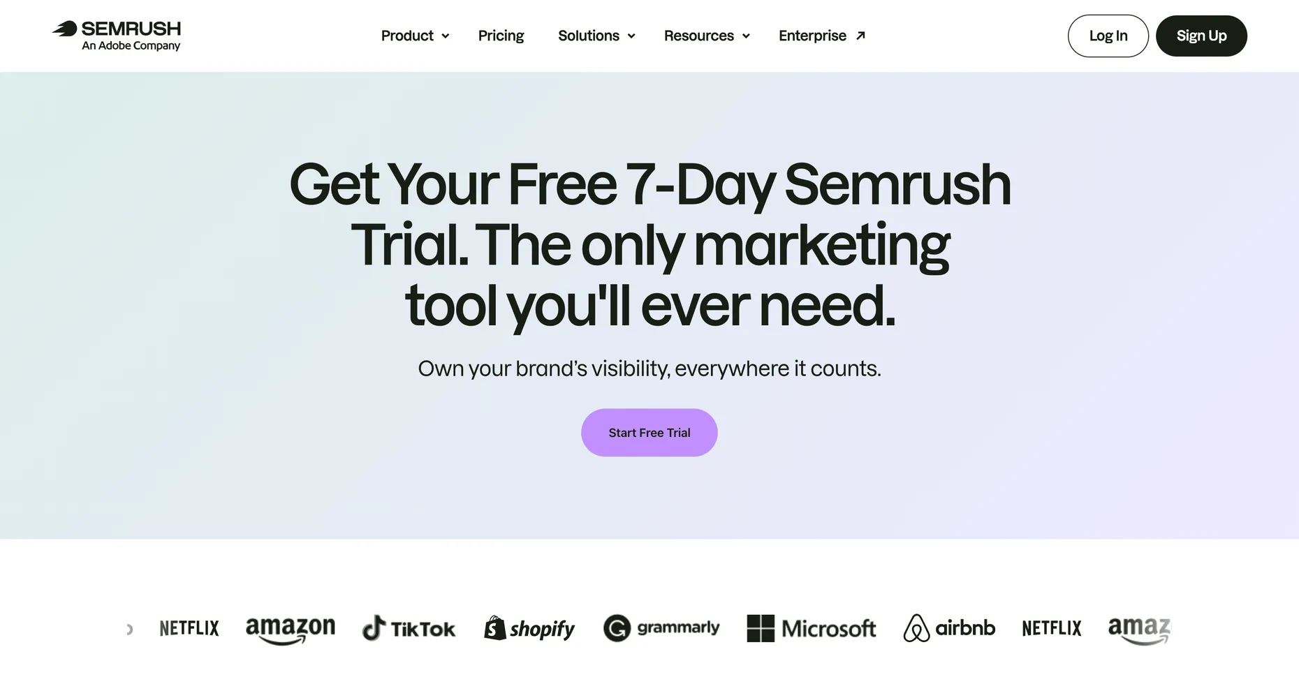 The Semrush free trial page with a large headline reading Get Your Free 7-Day Semrush Trial, The only marketing tool you'll ever need, above a Start Free Trial button, with the Semrush logo showing An Adobe Company
